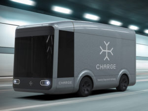 Silver electric truck with 'Charge' logo going through tunnel